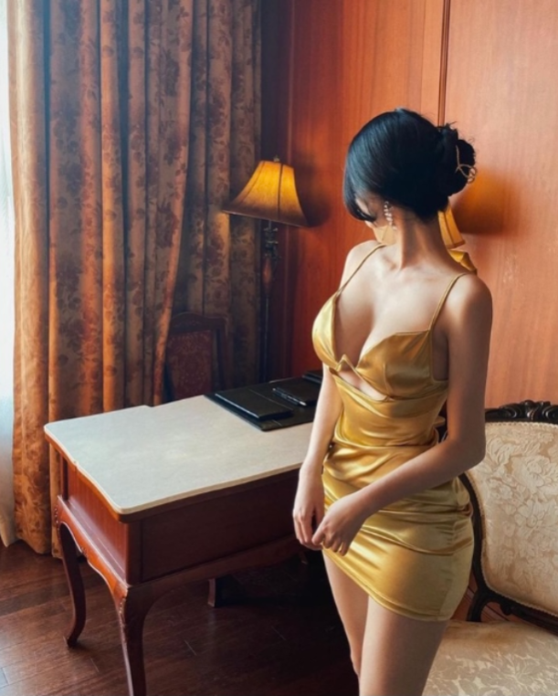 beautiful asian woman in a gold coloured dress  sugarcoupling.com
